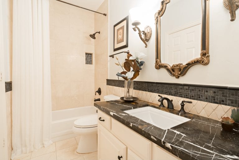 Design-by-Keti-Dallas-Texas-Renovations-Interior-Design-Home-Staging-Luxury-Guest-Bathroom-Light-Vanity-Dark-Stone-Countertop-Shower-University-Park