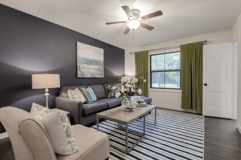 Design-by-Keti-Dallas-Texas-Renovations-Interior-Design-Home-Staging-Luxury-Seating-Dark-Accent-Wall-Striped-Area-Rug-Ceiling-Fan-Artwork-Northwood-Hills