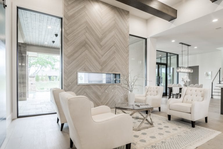 Custom home interior design with modern fireplace and architectural details in Dallas