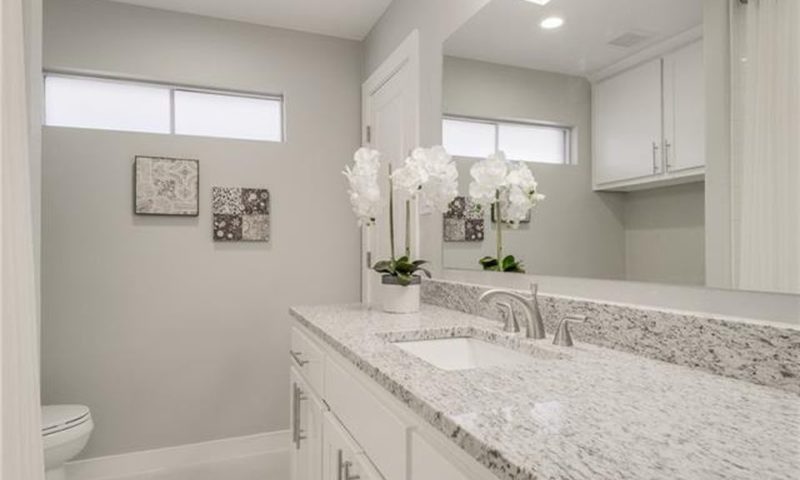 Design-by-Keti-Dallas-Texas-Renovations-Interior-Design-Luxury-Bathroom-Light-Vanity-Large-Mirror-Small-Windows-Preston-Hollow
