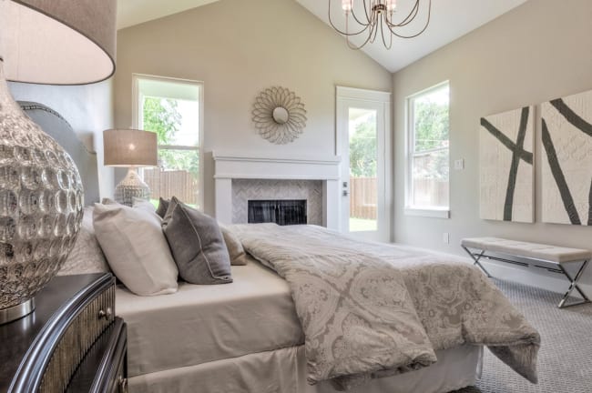 bedroom staged in dallas cream neutral palette home value increased