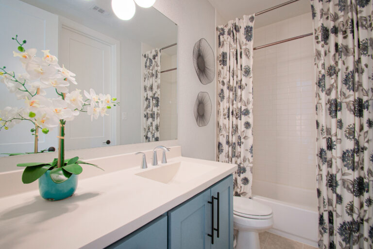 Design-by-Keti-Dallas-Texas-Renovations-Interior-Design-Luxury-Guest-Bathroom-Lake-Highlands-Blue-Vanity-Floral-Shower-Curtain