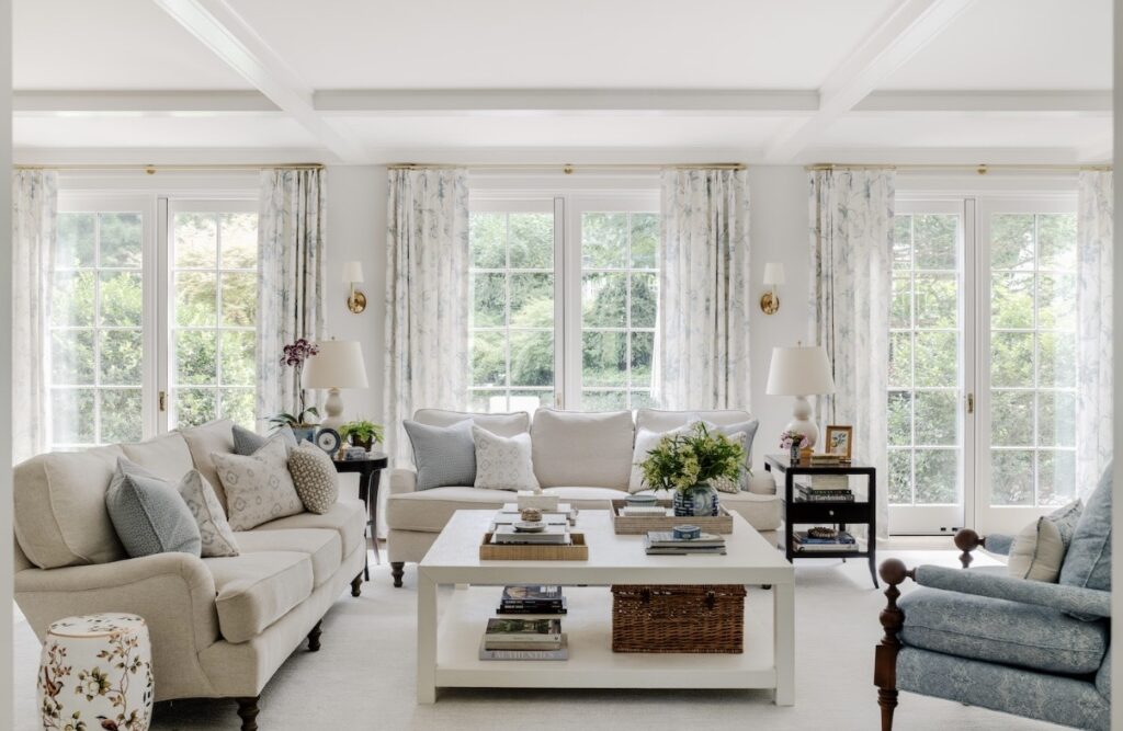 Modern neutral living room with layered lighting, balanced furniture layout, and warm modern classic interior design