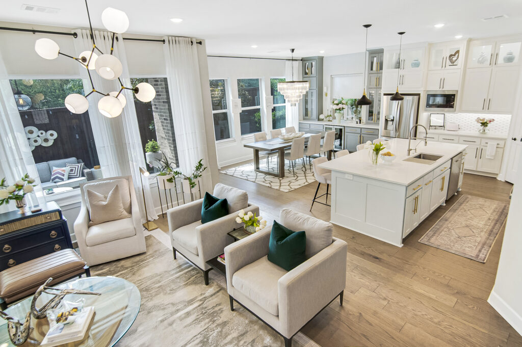 Open-concept Lake Highlands living room and white kitchen with a large island